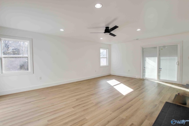 unfurnished room with light hardwood / wood-style floors and ceiling fan