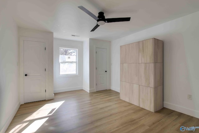 unfurnished bedroom featuring ceiling fan and light hardwood / wood-style flooring