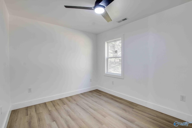 empty room with light wood-type flooring and ceiling fan