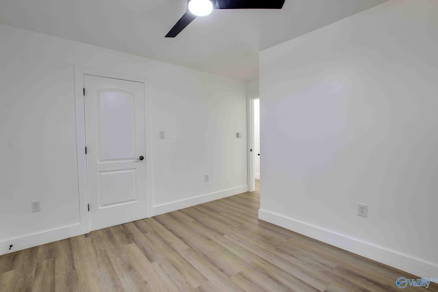 empty room featuring ceiling fan and light hardwood / wood-style flooring