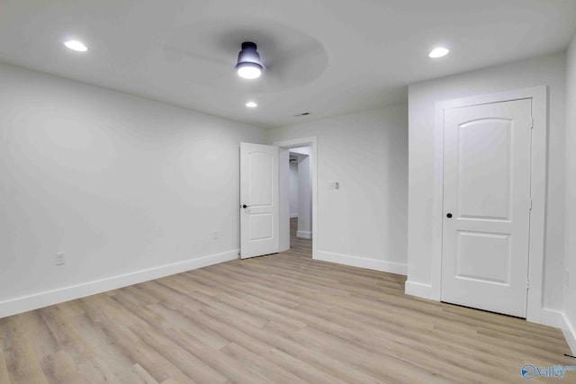 unfurnished bedroom with light wood-type flooring and ceiling fan