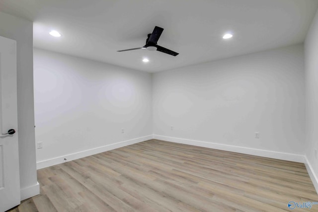 empty room featuring ceiling fan and light hardwood / wood-style floors