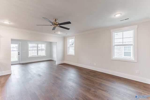 empty room with dark hardwood / wood-style flooring, ornamental molding, and ceiling fan