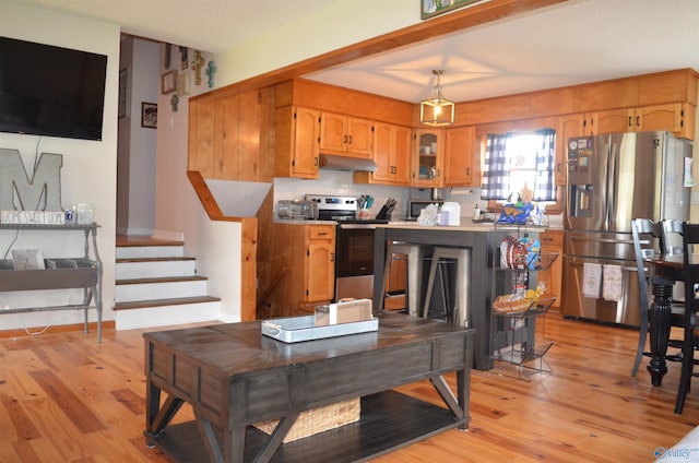 kitchen featuring light hardwood / wood-style flooring and appliances with stainless steel finishes