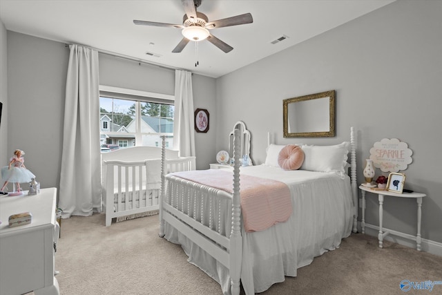 carpeted bedroom featuring ceiling fan