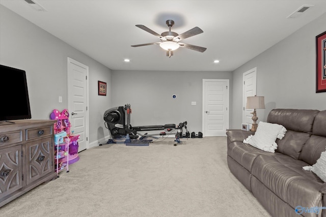 interior space with ceiling fan and light colored carpet