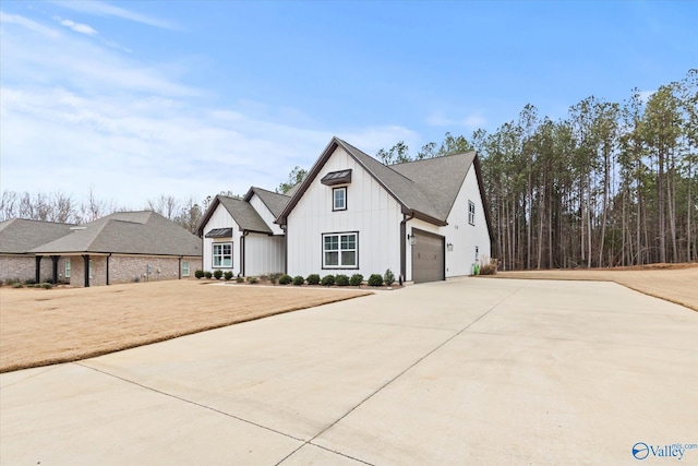 modern farmhouse style home featuring a garage