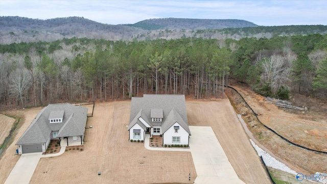 birds eye view of property with a mountain view