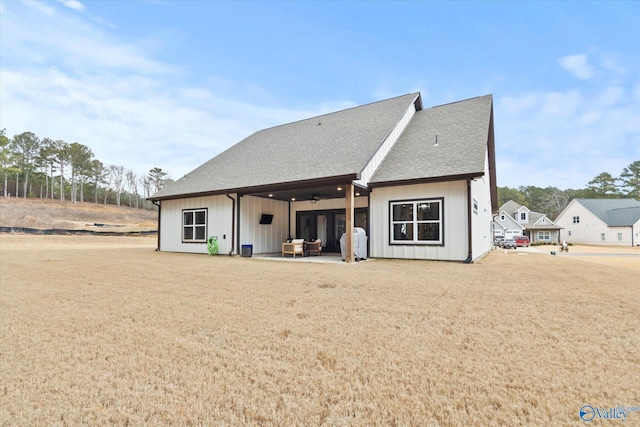 back of property featuring ceiling fan and a patio area