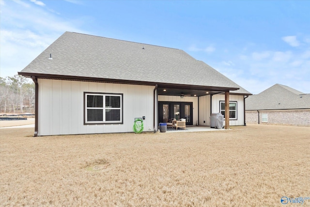 rear view of property featuring a patio area, ceiling fan, and french doors