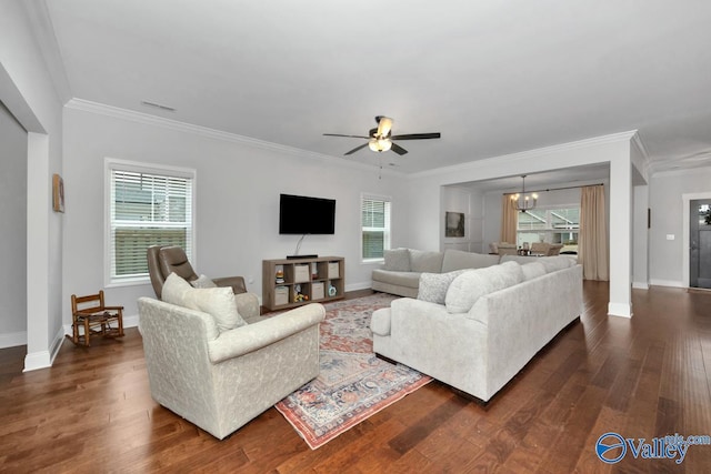 living area with dark wood-type flooring, visible vents, and baseboards