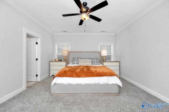 unfurnished bedroom featuring baseboards, crown molding, visible vents, and light colored carpet