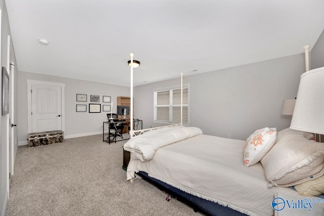 carpeted bedroom featuring baseboards