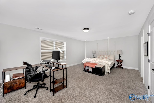 bedroom featuring baseboards, visible vents, and light colored carpet