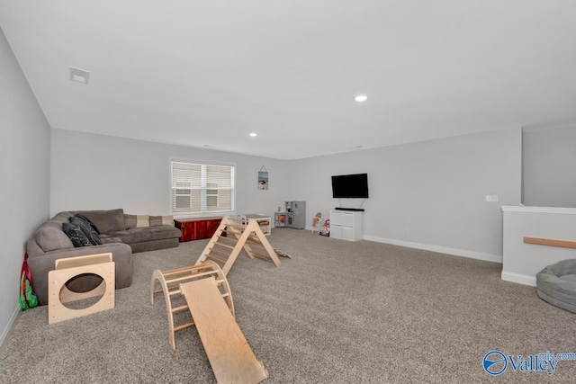 living room with carpet, visible vents, baseboards, and recessed lighting