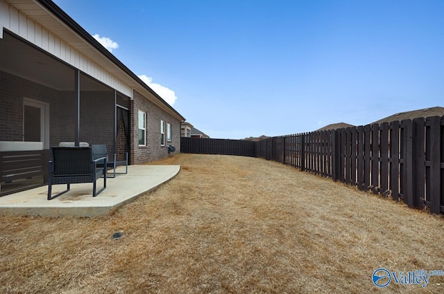 view of yard featuring a fenced backyard and a patio