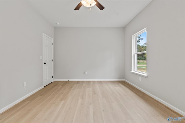 spare room featuring light hardwood / wood-style floors and ceiling fan