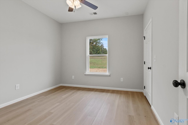 empty room featuring ceiling fan and light wood-type flooring