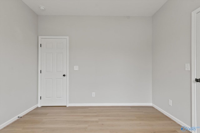 unfurnished room with light hardwood / wood-style floors