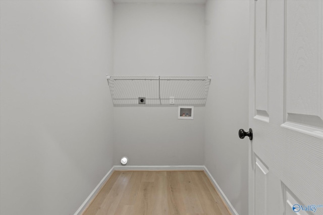 laundry area with light hardwood / wood-style floors, hookup for a washing machine, and electric dryer hookup