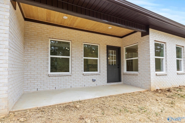 property entrance with a patio area