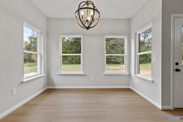 interior space with a notable chandelier and plenty of natural light