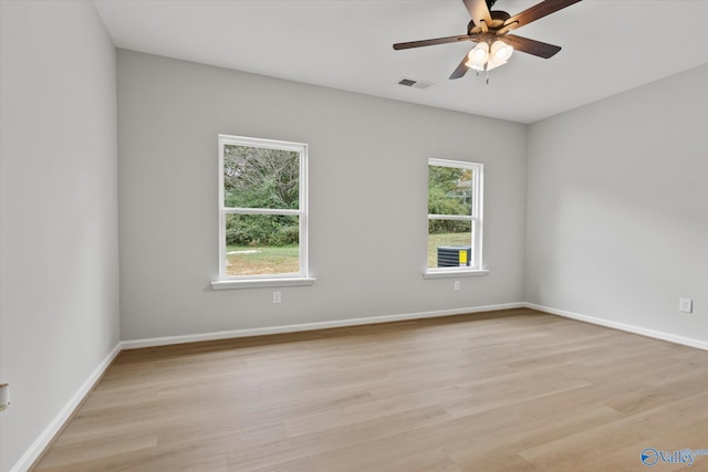 spare room with light hardwood / wood-style floors and ceiling fan