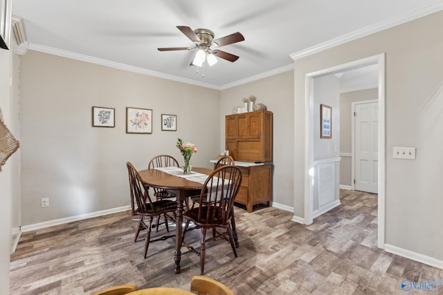 dining area with ceiling fan, wood-type flooring, and ornamental molding