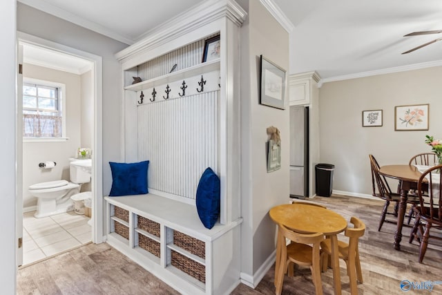 mudroom featuring ceiling fan, light wood-type flooring, and ornamental molding