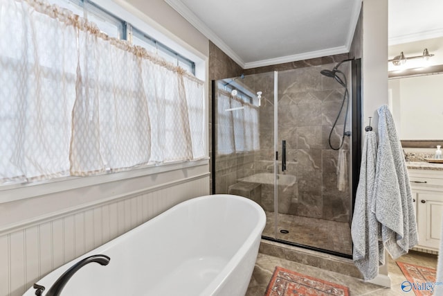 bathroom featuring vanity, ornamental molding, and independent shower and bath