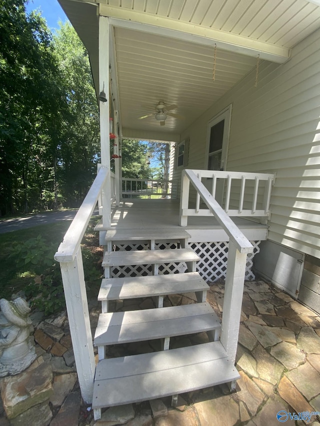 view of patio with ceiling fan and a porch