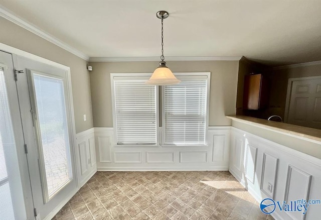 unfurnished dining area featuring crown molding