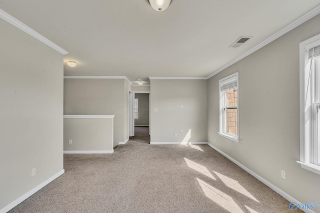 carpeted empty room featuring ornamental molding