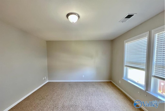 view of carpeted spare room