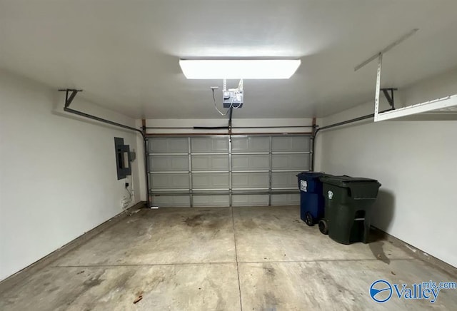 garage featuring a garage door opener and electric panel