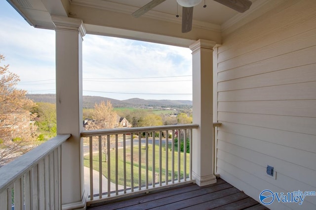 balcony with ceiling fan and a mountain view