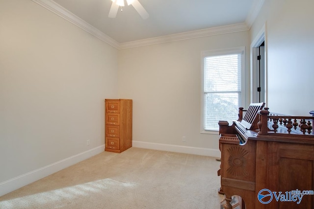 home office with ceiling fan, light carpet, and ornamental molding