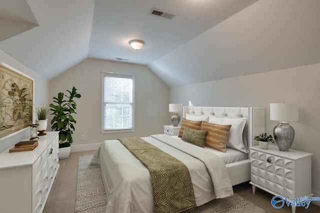 bedroom featuring carpet and lofted ceiling