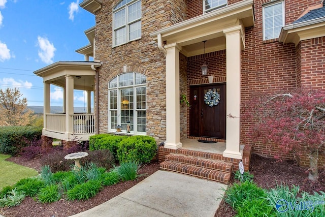 view of exterior entry featuring a porch