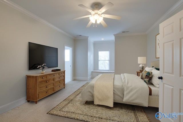 carpeted bedroom with ceiling fan and ornamental molding