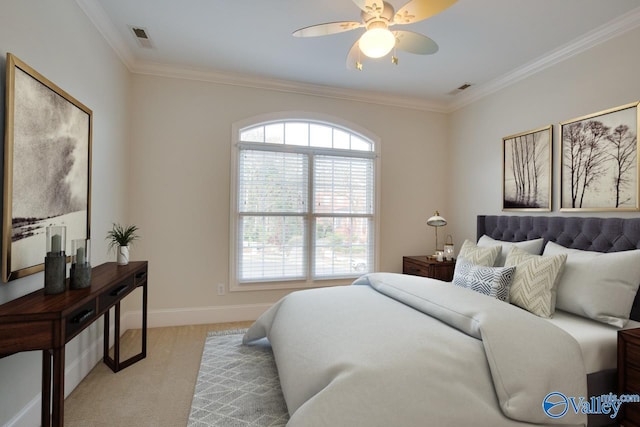 carpeted bedroom featuring ceiling fan and crown molding