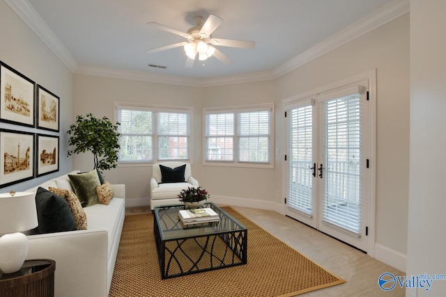 living room with french doors, light colored carpet, ceiling fan, and crown molding