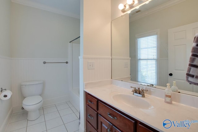 bathroom with toilet, vanity, tile patterned floors, and crown molding