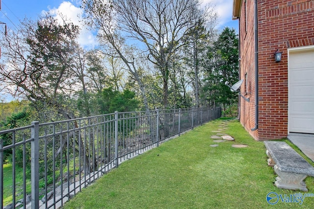 view of yard featuring a garage