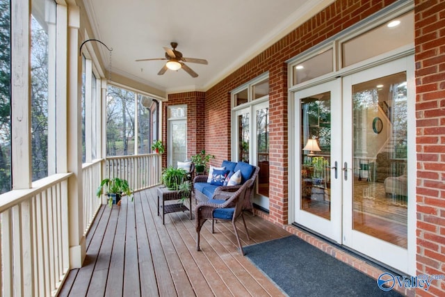 sunroom with ceiling fan and french doors