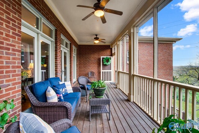 exterior space with ceiling fan and an outdoor hangout area