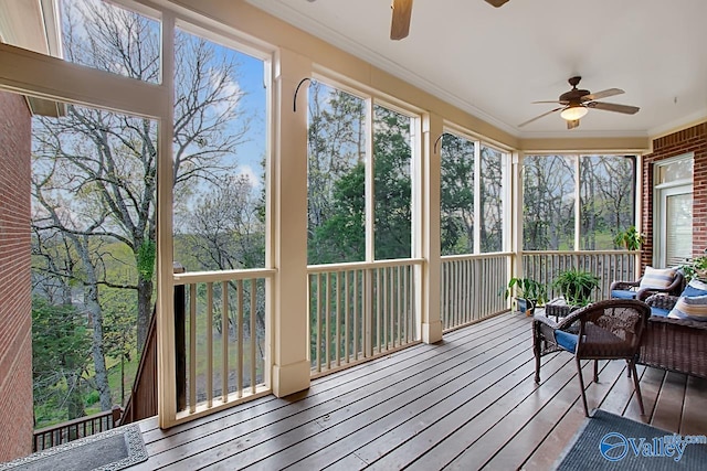 sunroom featuring ceiling fan