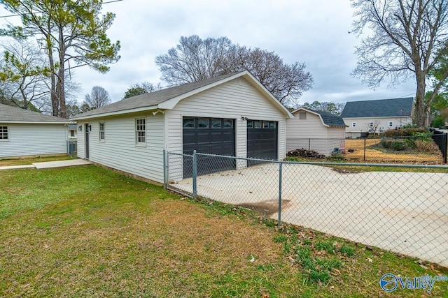 detached garage featuring fence