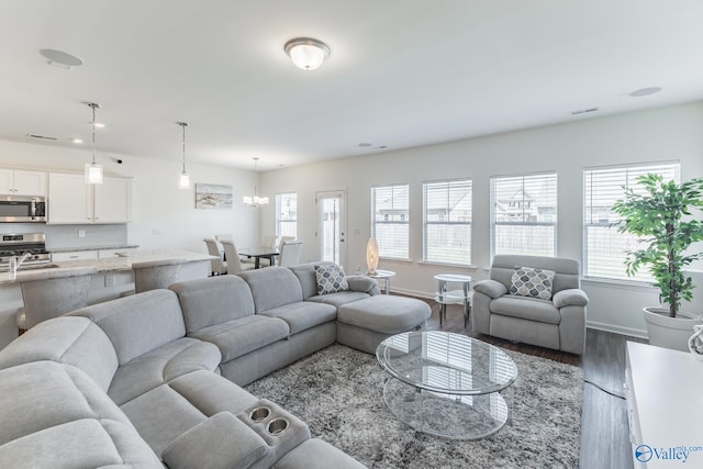 living room featuring hardwood / wood-style floors and a healthy amount of sunlight