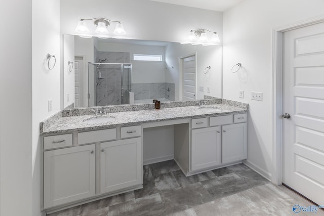 bathroom with vanity and an enclosed shower